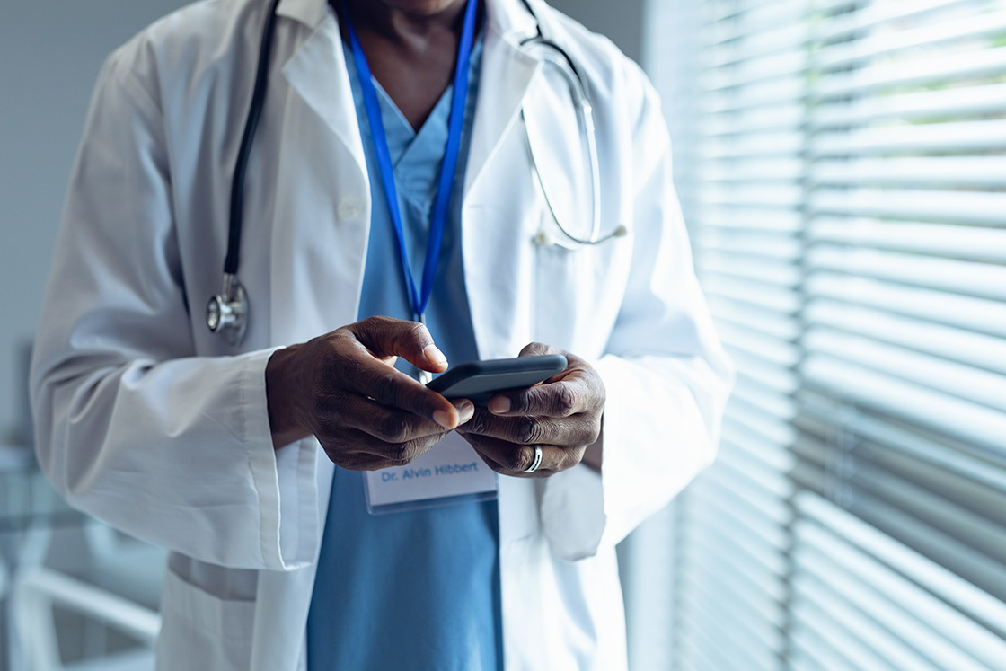Image of a doctor using a phone