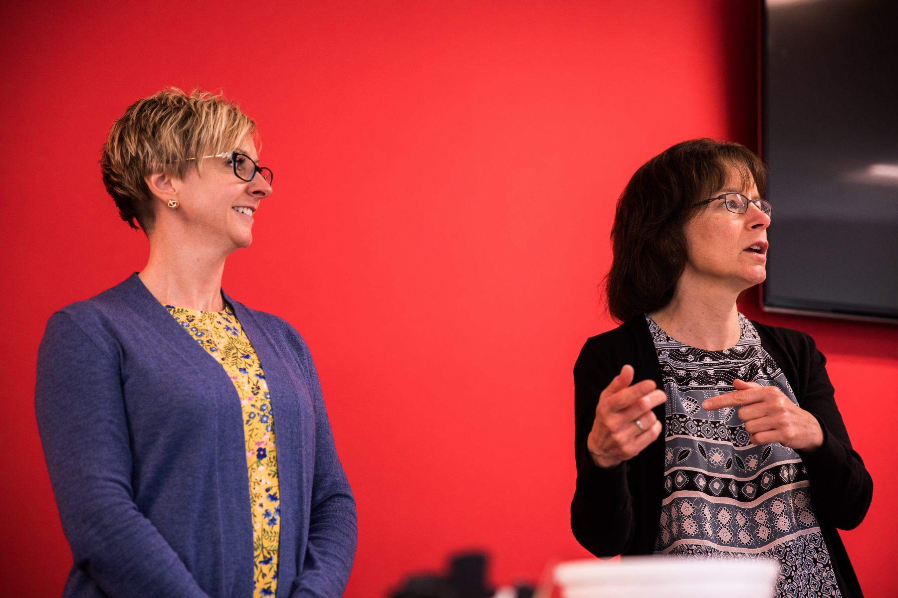 Image of two employees leading a presentation