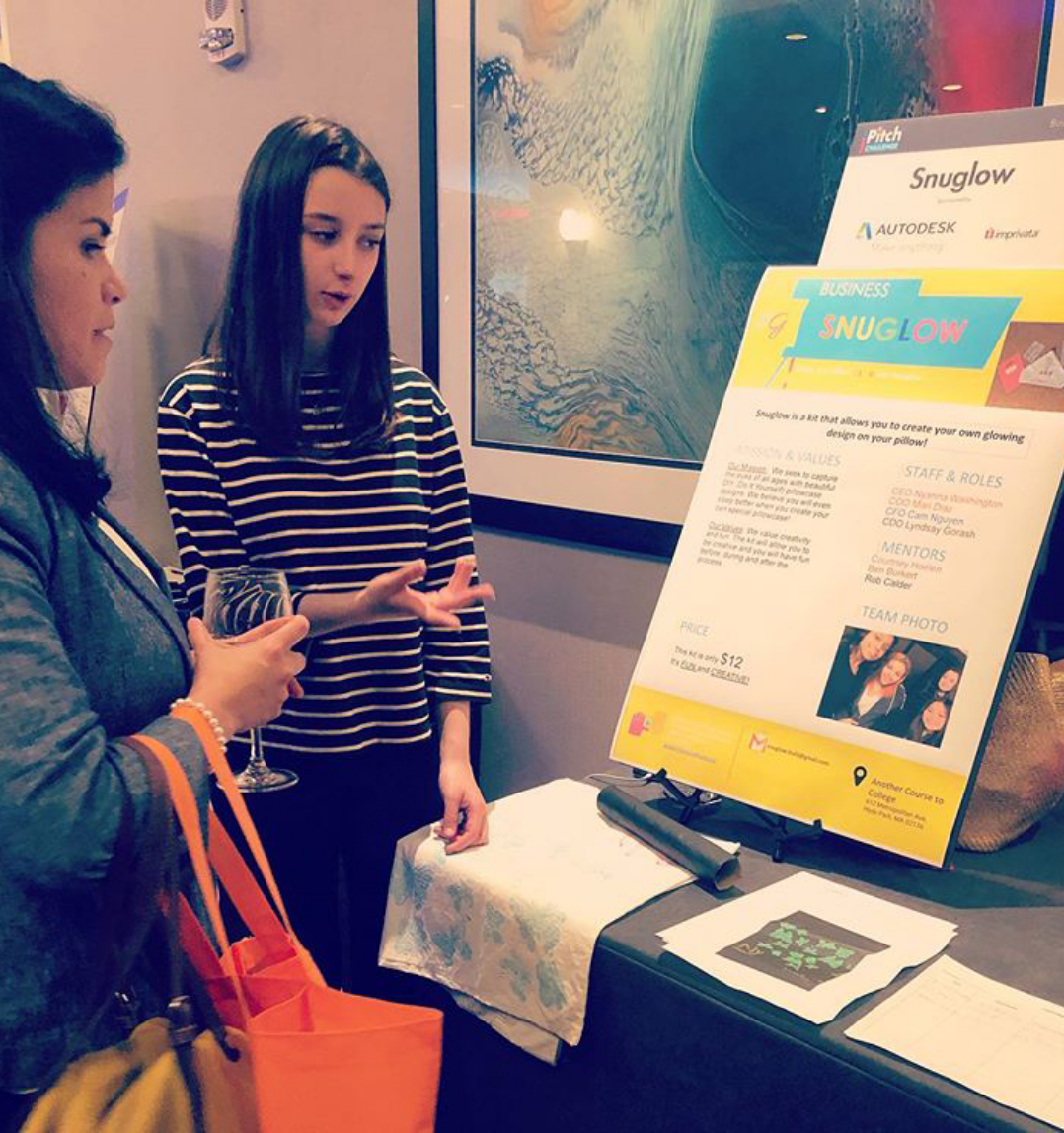 Photograph of two people looking at a display