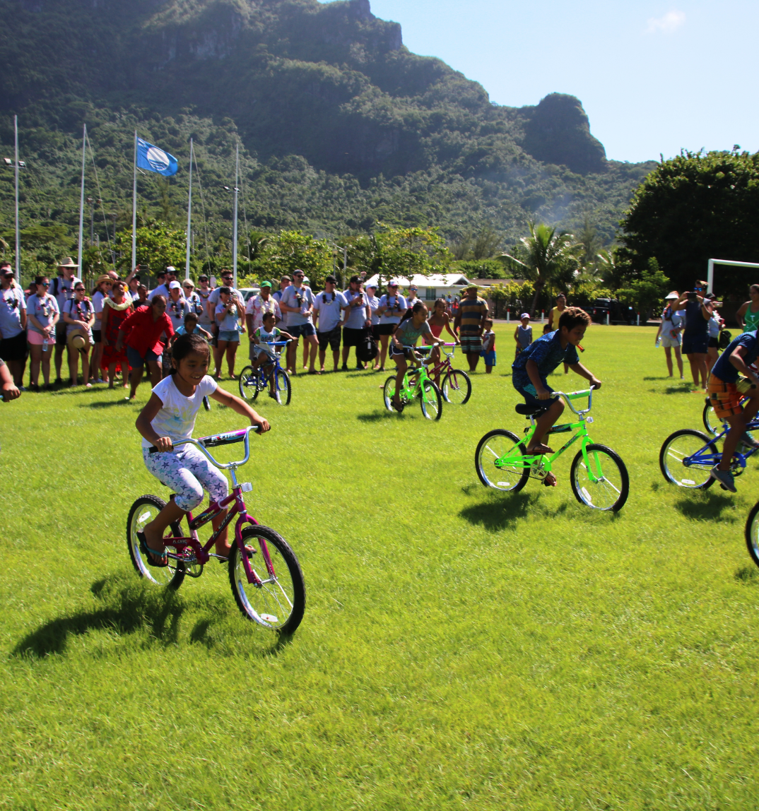 Photograph of a group of children riding bicycles