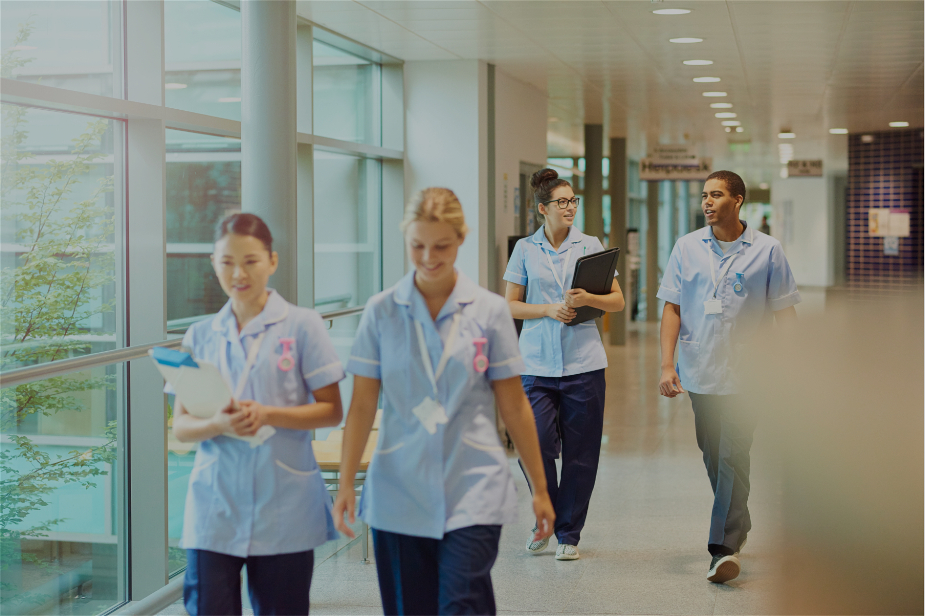 Image of a group of nurses walking down a hallway