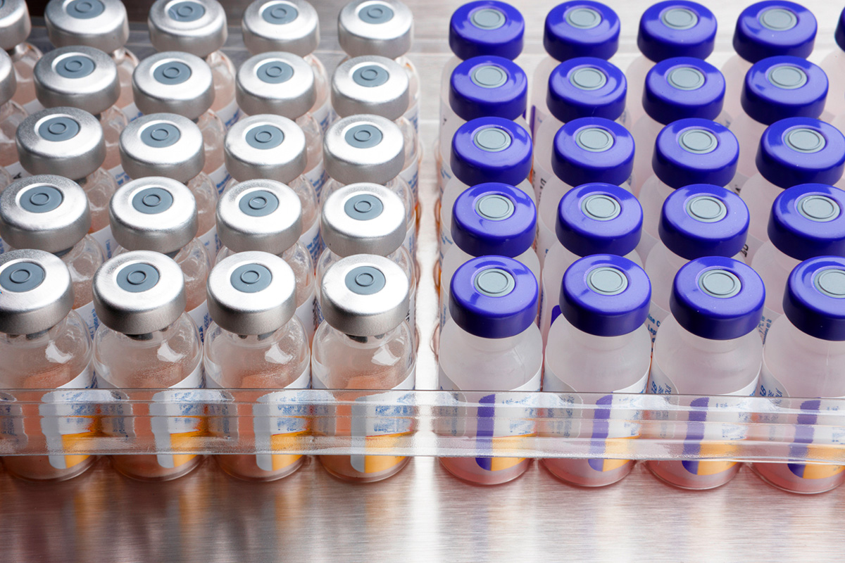 Image of medical bottles lined up in a rack