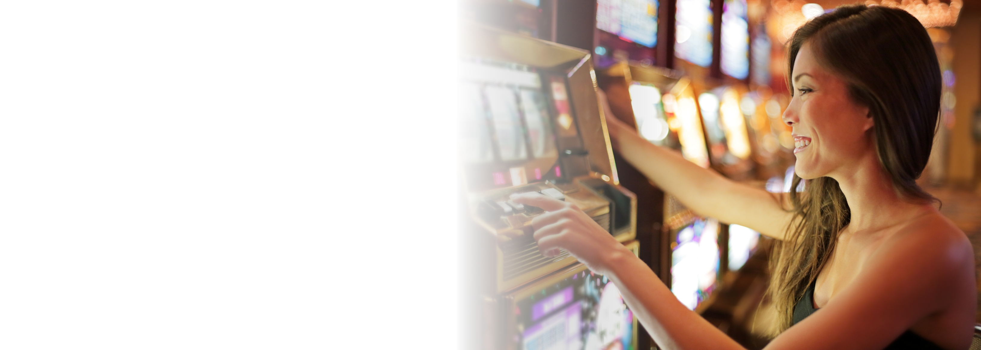 woman at casino using slot machine