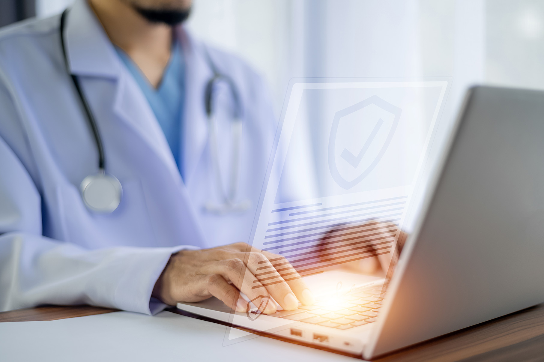 Image of a doctor using a laptop