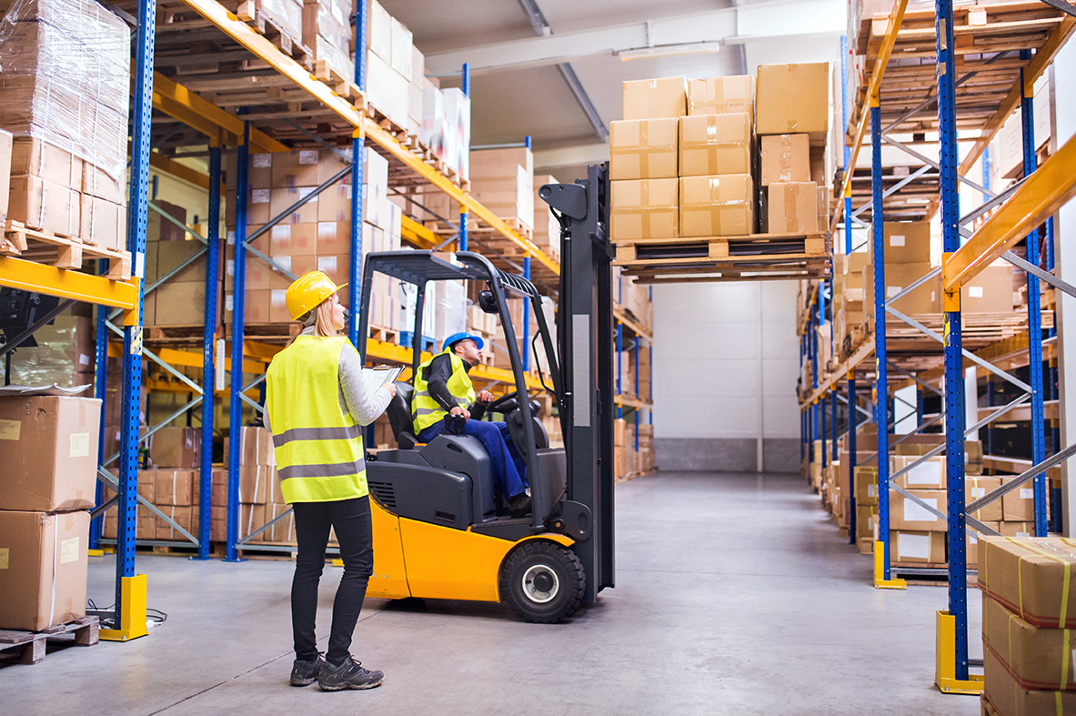 Warehouse workers with forklift