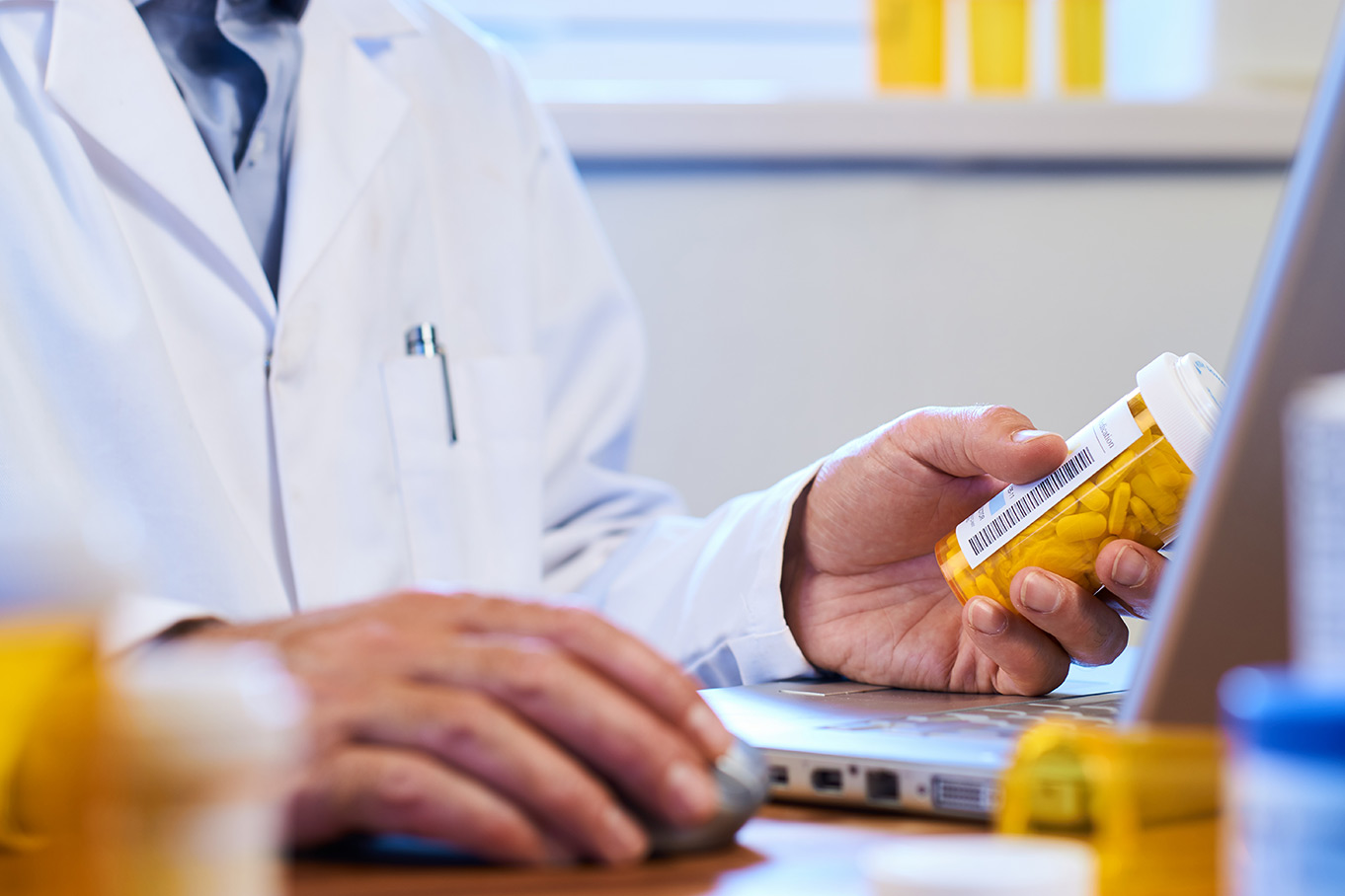Image of a doctor inputting prescription