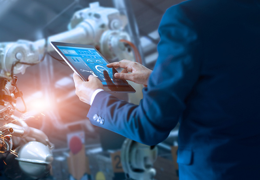 Manufacturing professional with mobile device