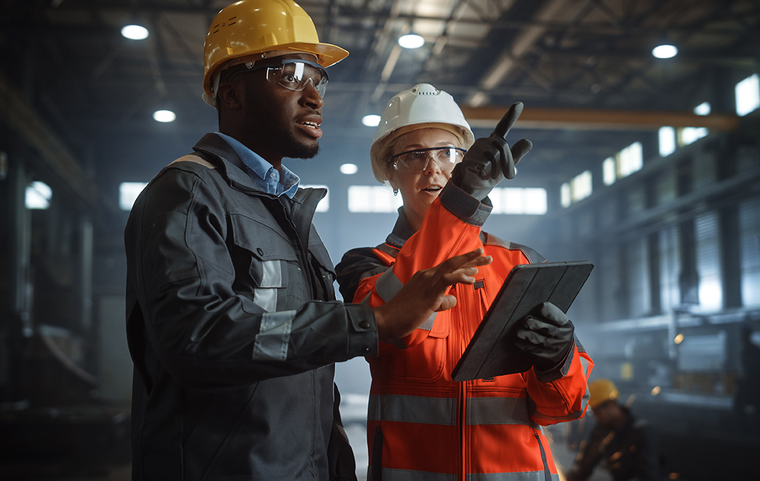 Manufacturing professionals with device