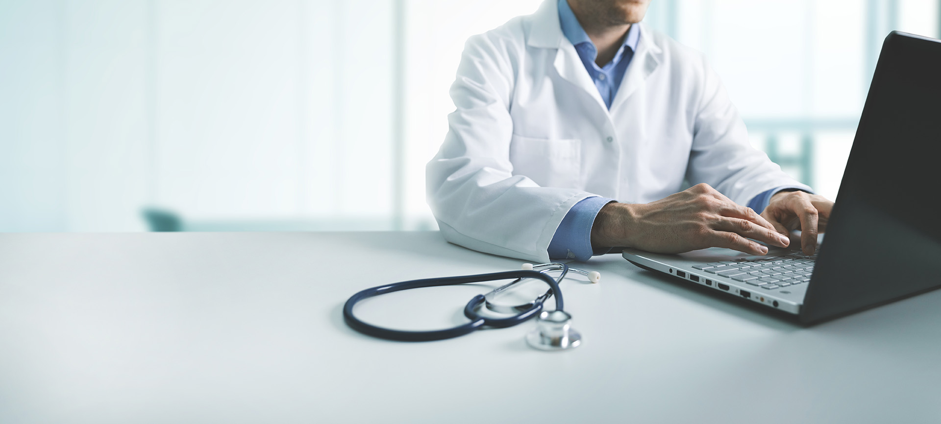 Clincian with laptop