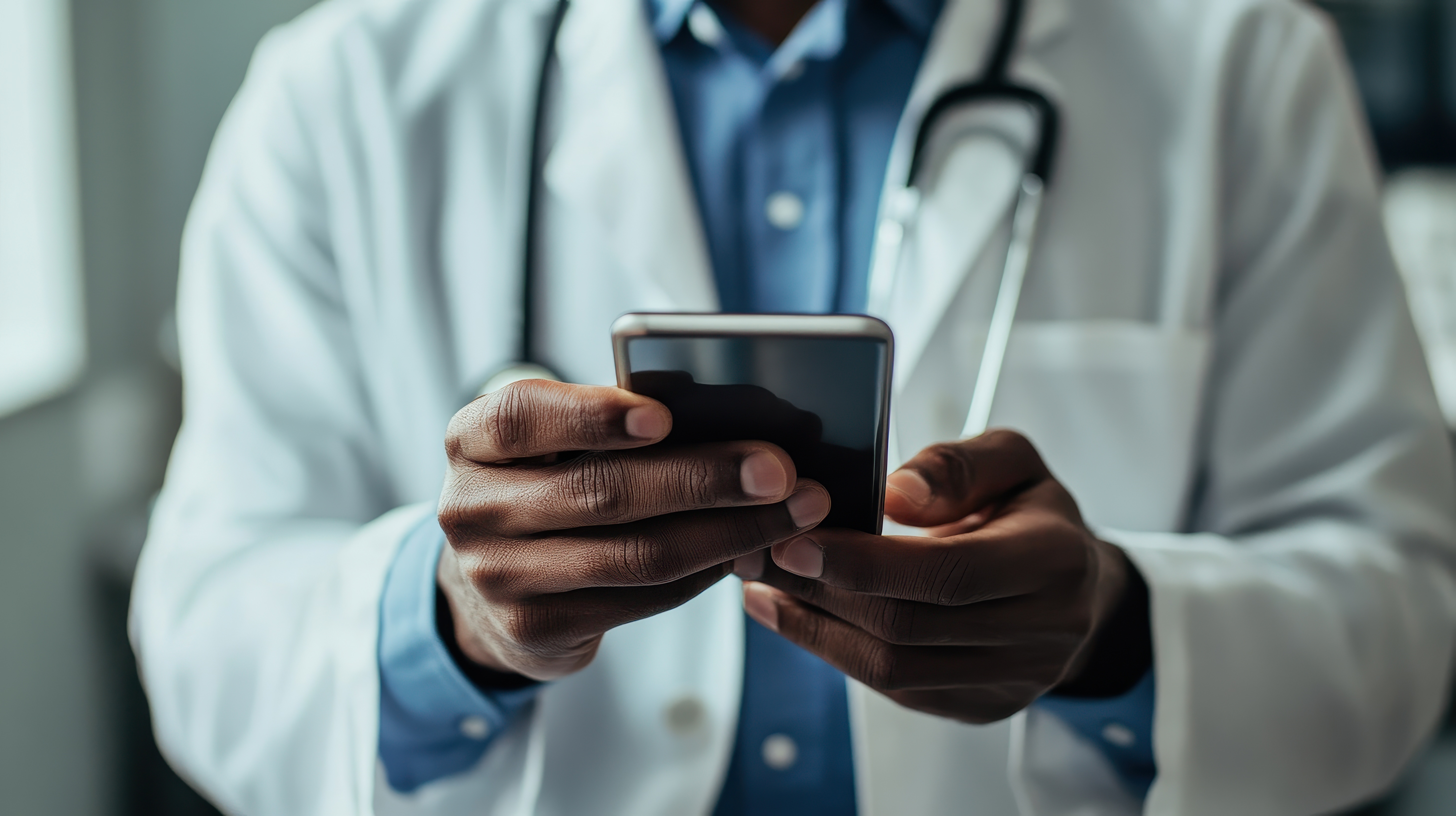 Doctor holding a mobile phone