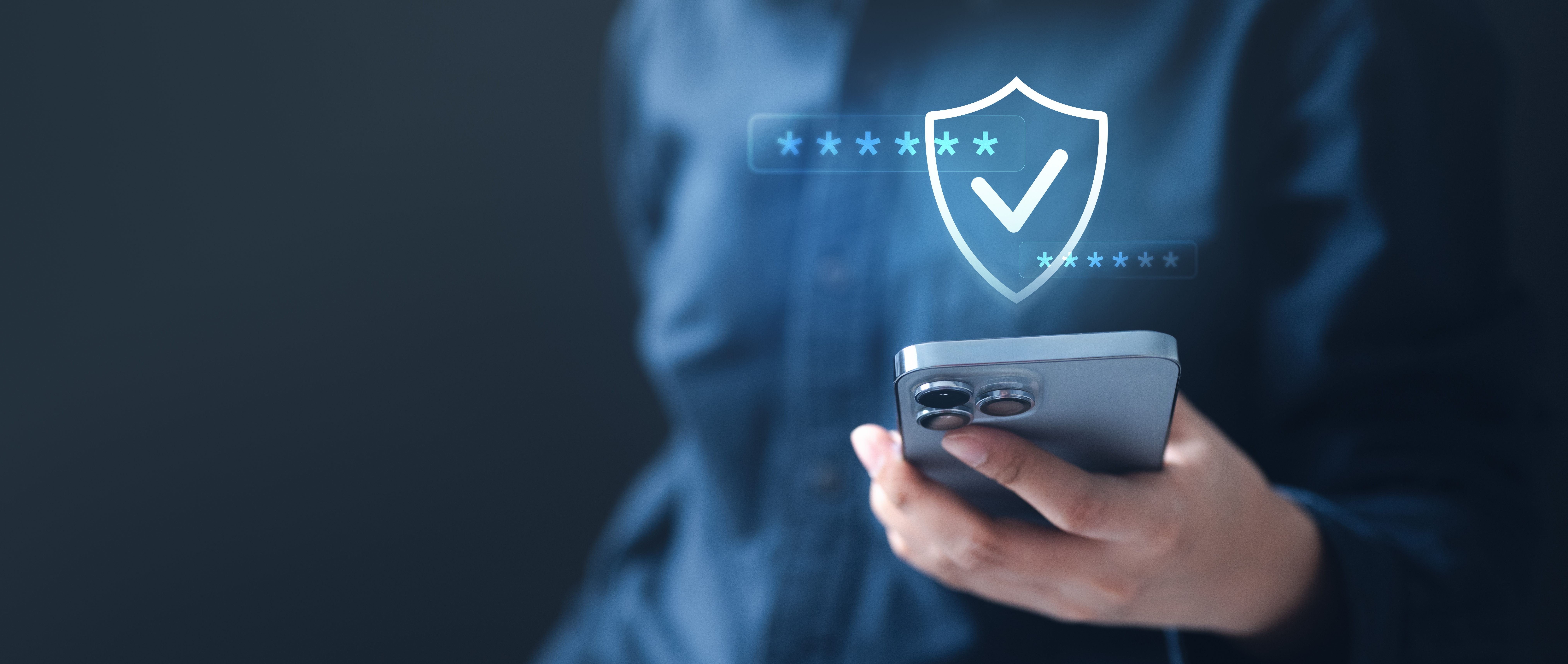 Image of person holding mobile device with a digital security check icon digitally overlaid