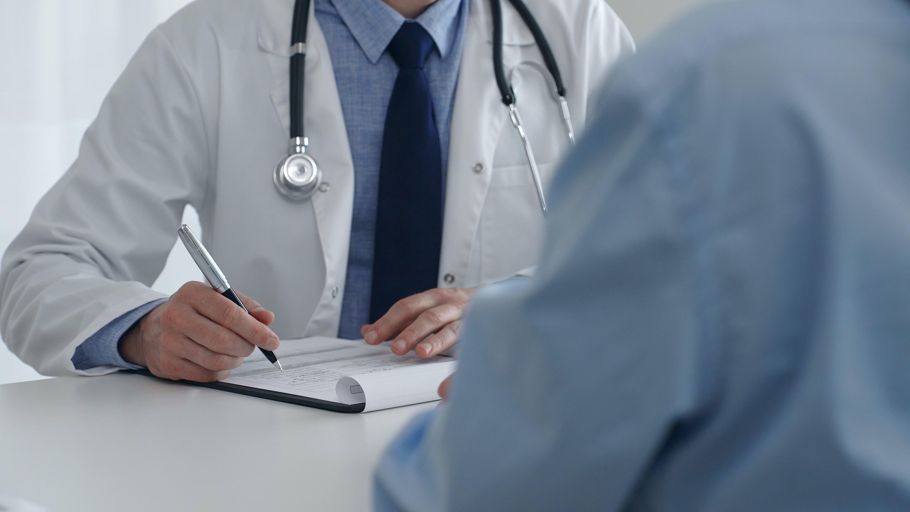 Photo of doctor conversing with patient