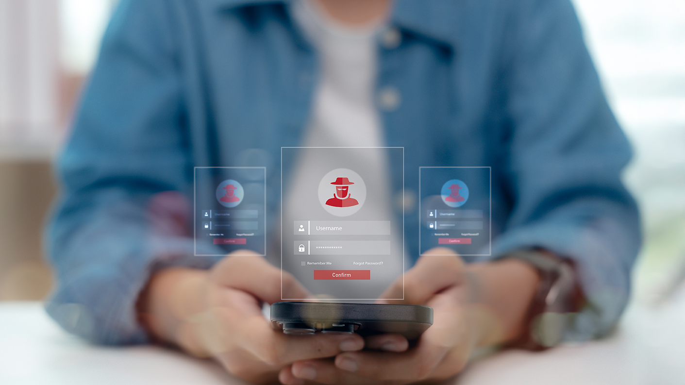 Fraudulent online accounts being created by a man holding a smartphone, online scam, identity theft, and cybersecurity risk