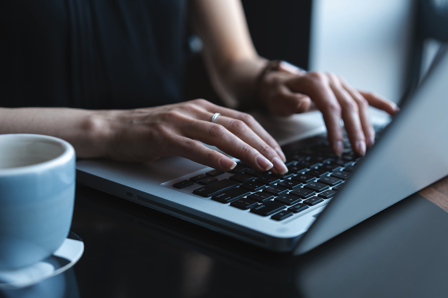 Photo of woman using a laptop