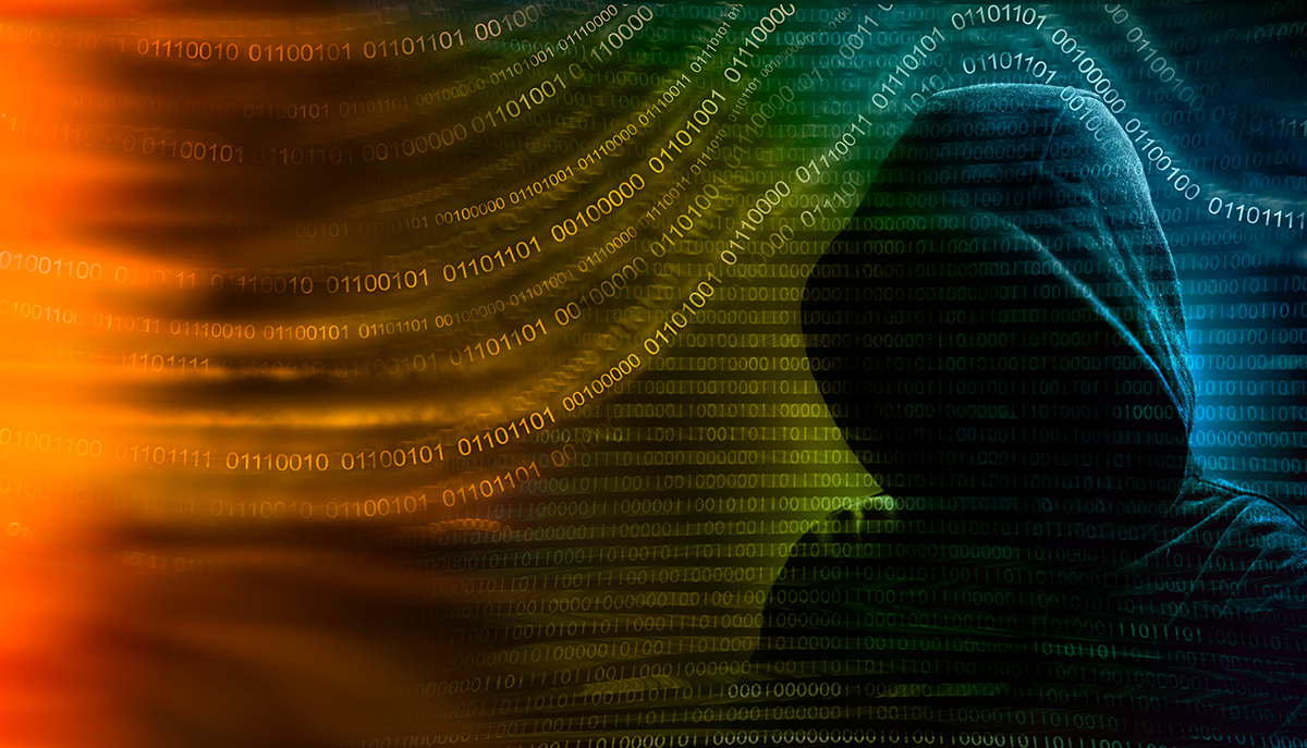 Hooded hacker in colorful image representing a data breach caused by credential compromise stolen passwords