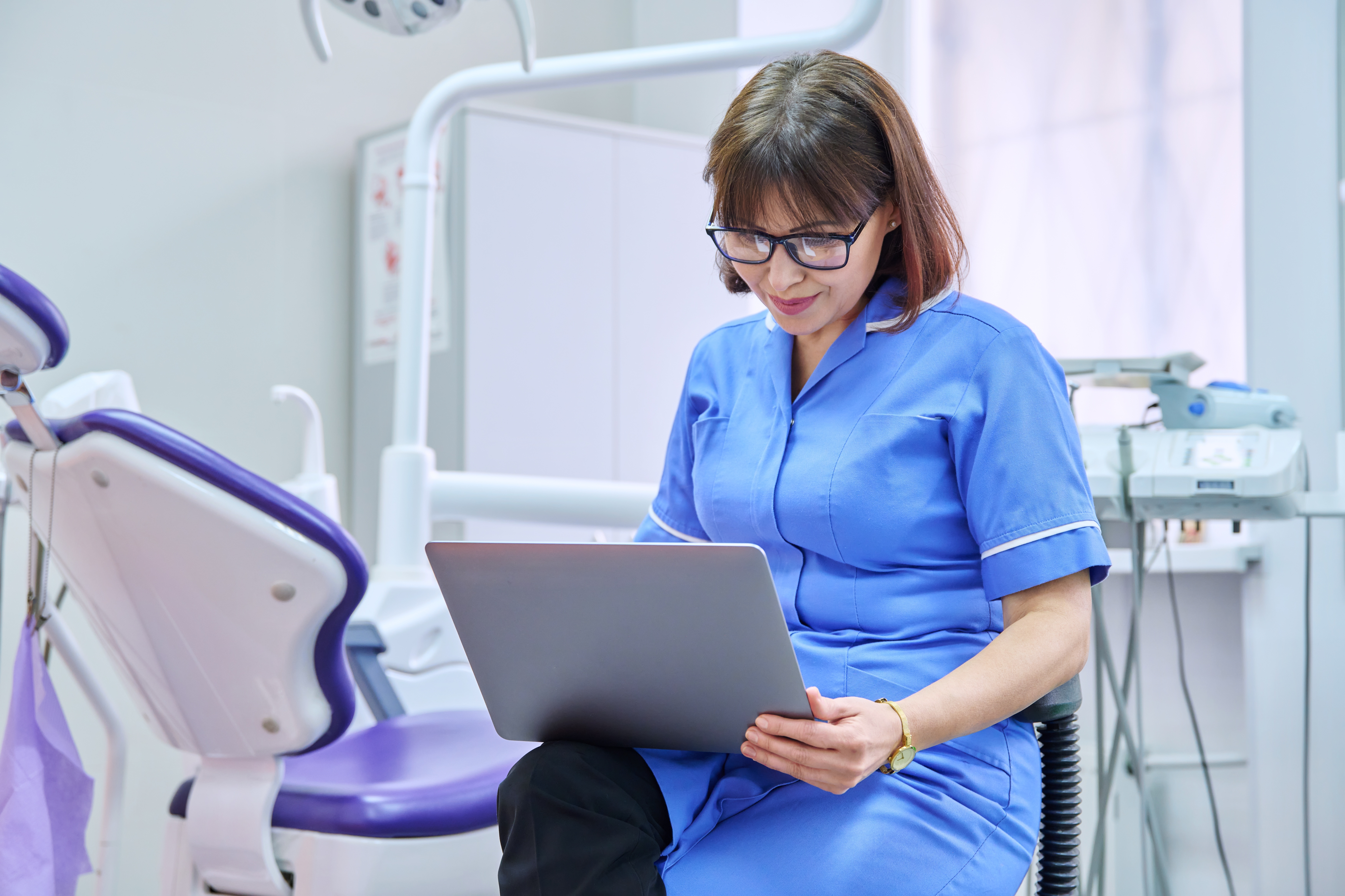 Clinician using digital device in hospital setting