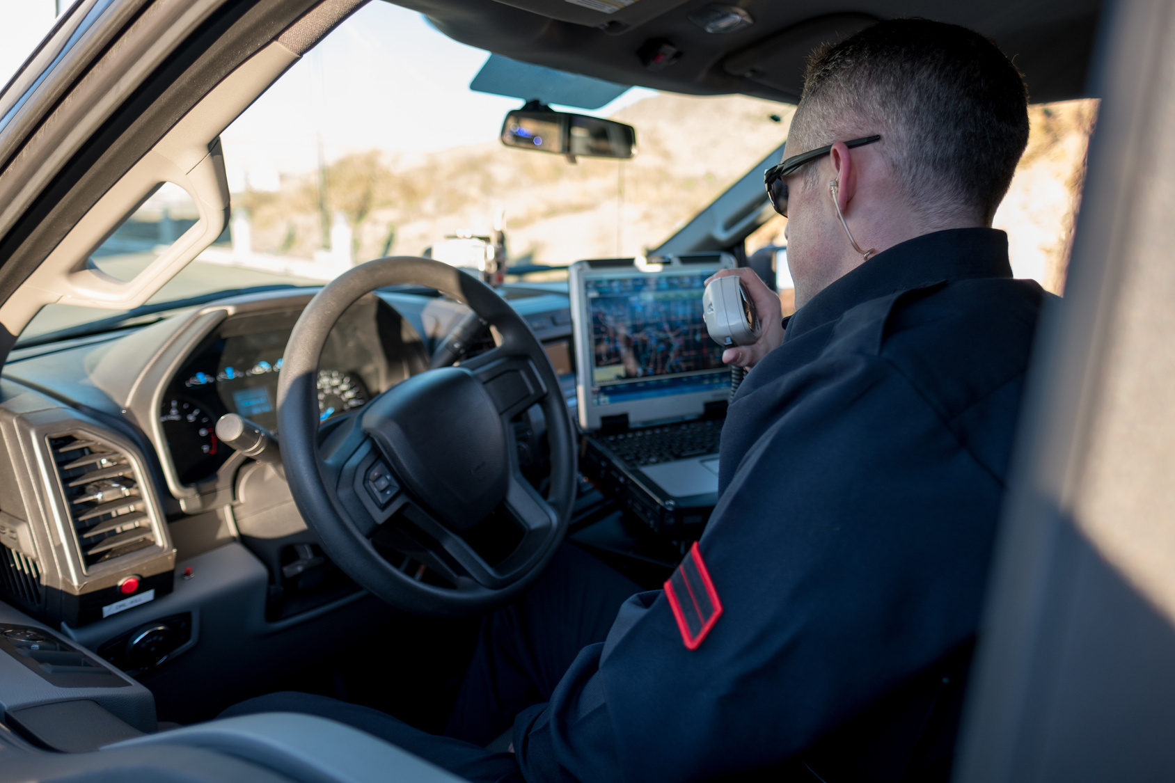Officer in police car