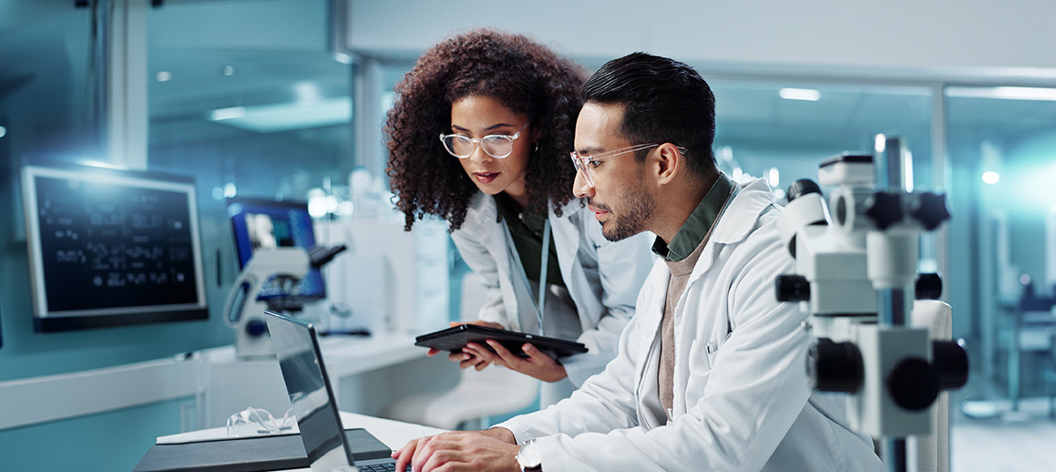 Pharmacists with computer