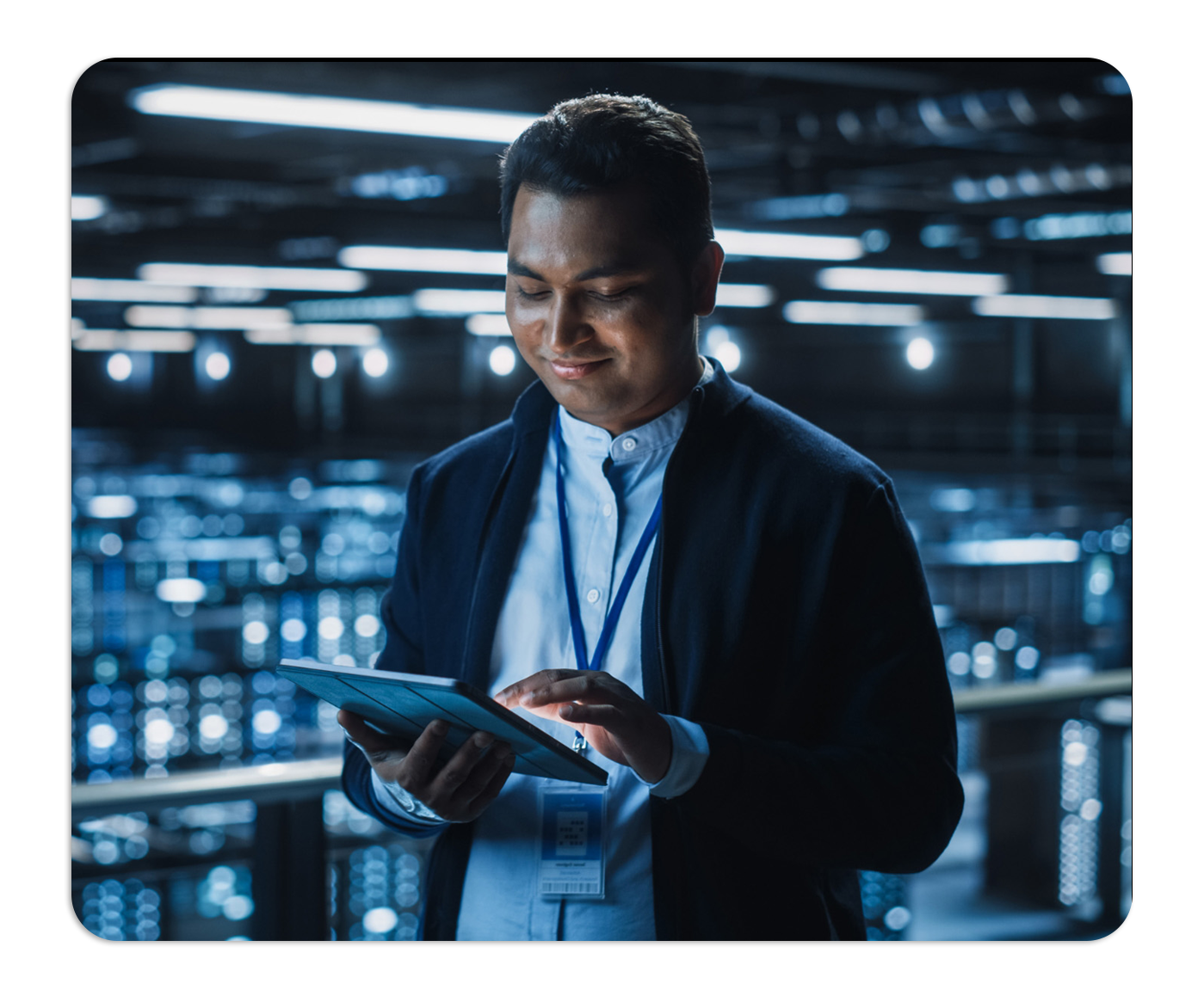 Worker in server room using ipad