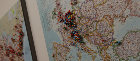 Photograph of a map with pins in it